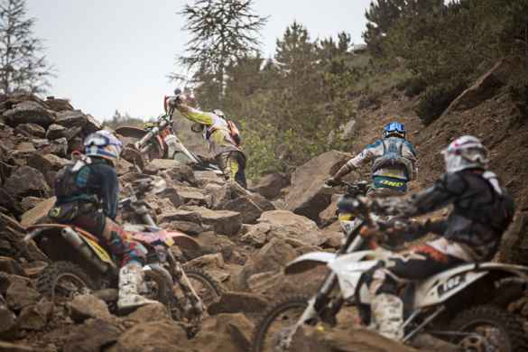 riders-stuck-in-a-boulder-field-during-the-red-bull-hare-scramble-hard-enduro-in-erzberg-austria
